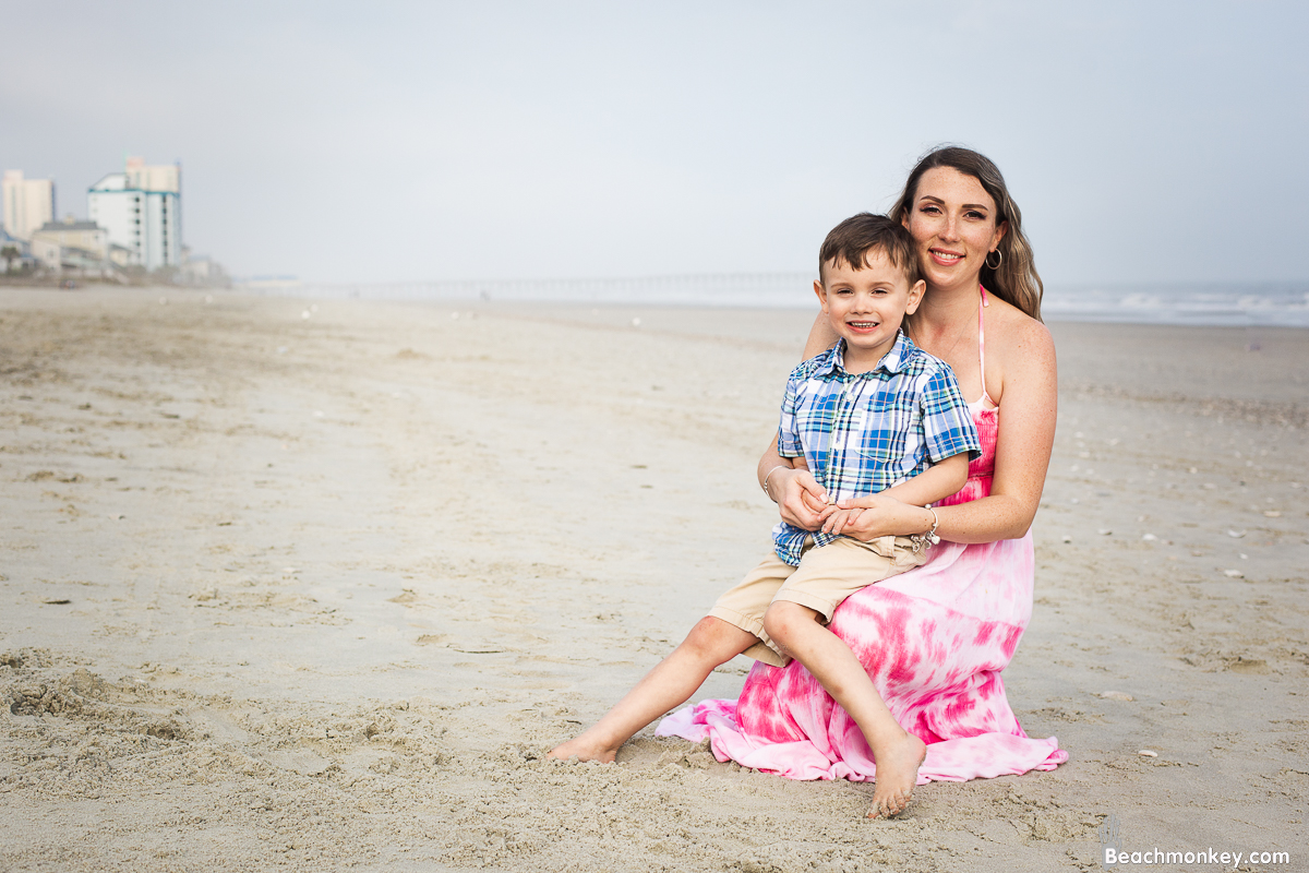 pregnant mother and child A family Beach photo shoot in North Myrtle Beach, SC with Sarah's family Separator  by Slava of beachmonkey photography, a family photographer on April 6th 2022