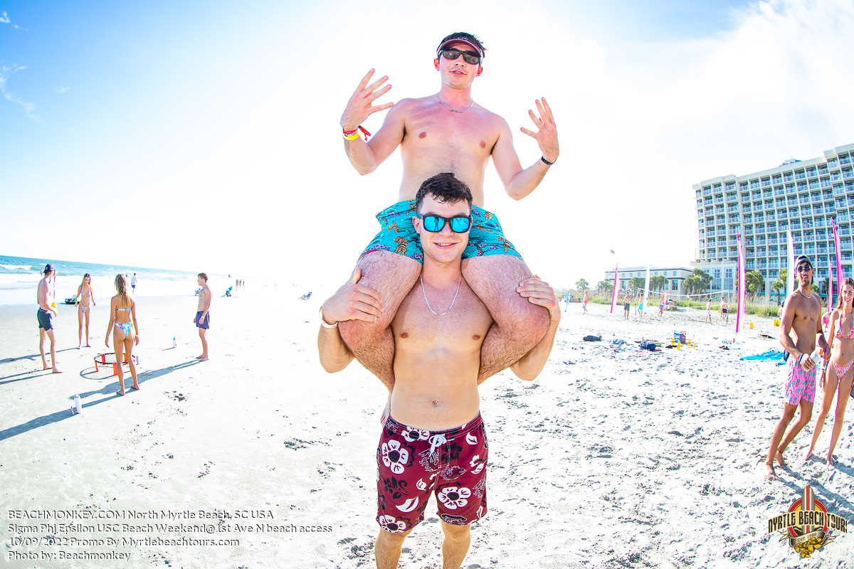 two fraternity brothers riding on shoulders Sigma Phi Epsilon Fraternity Beach Weekend North Myrtle Beach, SC USA sponsored by Myrtlebeachtours.com September 10 2022 Photos by Beachmonkey