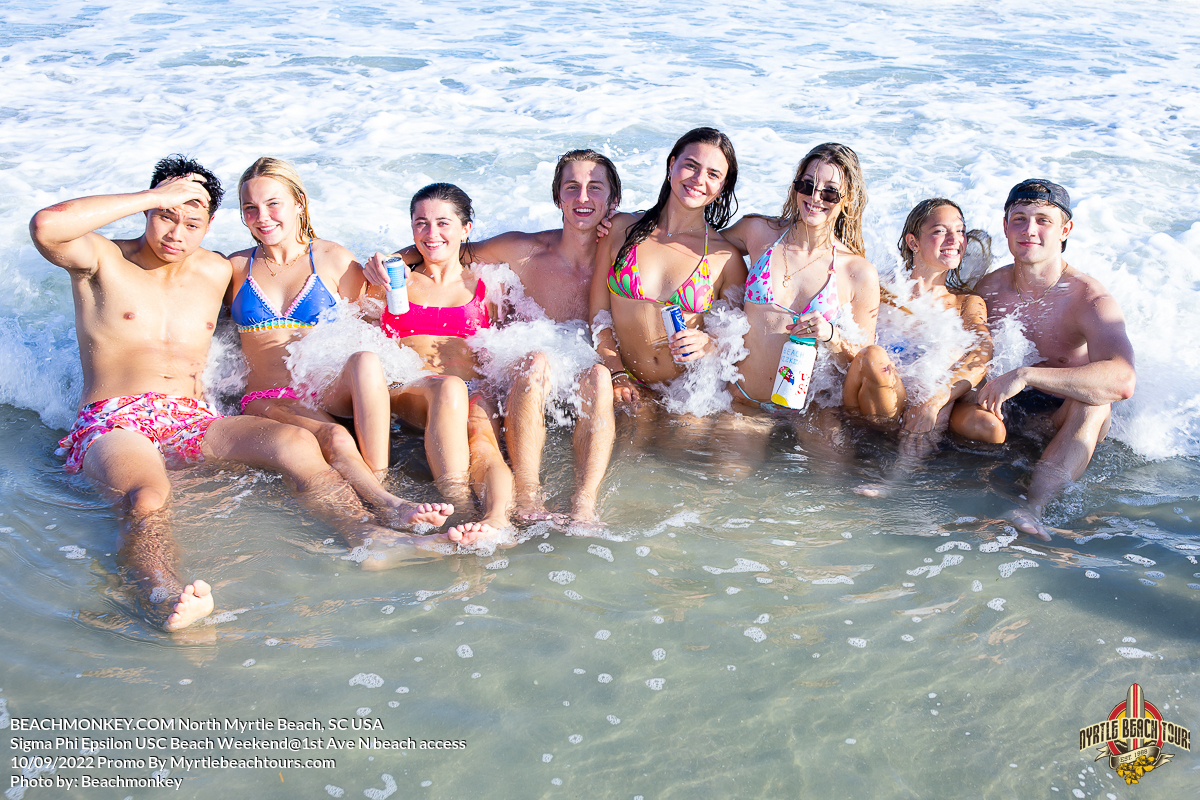 group of people sitting in water Sigma Phi Epsilon Fraternity Beach Weekend North Myrtle Beach, SC USA sponsored by Myrtlebeachtours.com September 10 2022 Photos by Beachmonkey