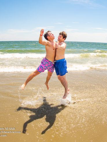 Two guys jumping into each other Theta Tau of University of South Carolina Weekend in North Myrtle Beach, SC USA sponsored by Myrtlebeachtours.com September 3rd 2022 Photos by Beachmonkey