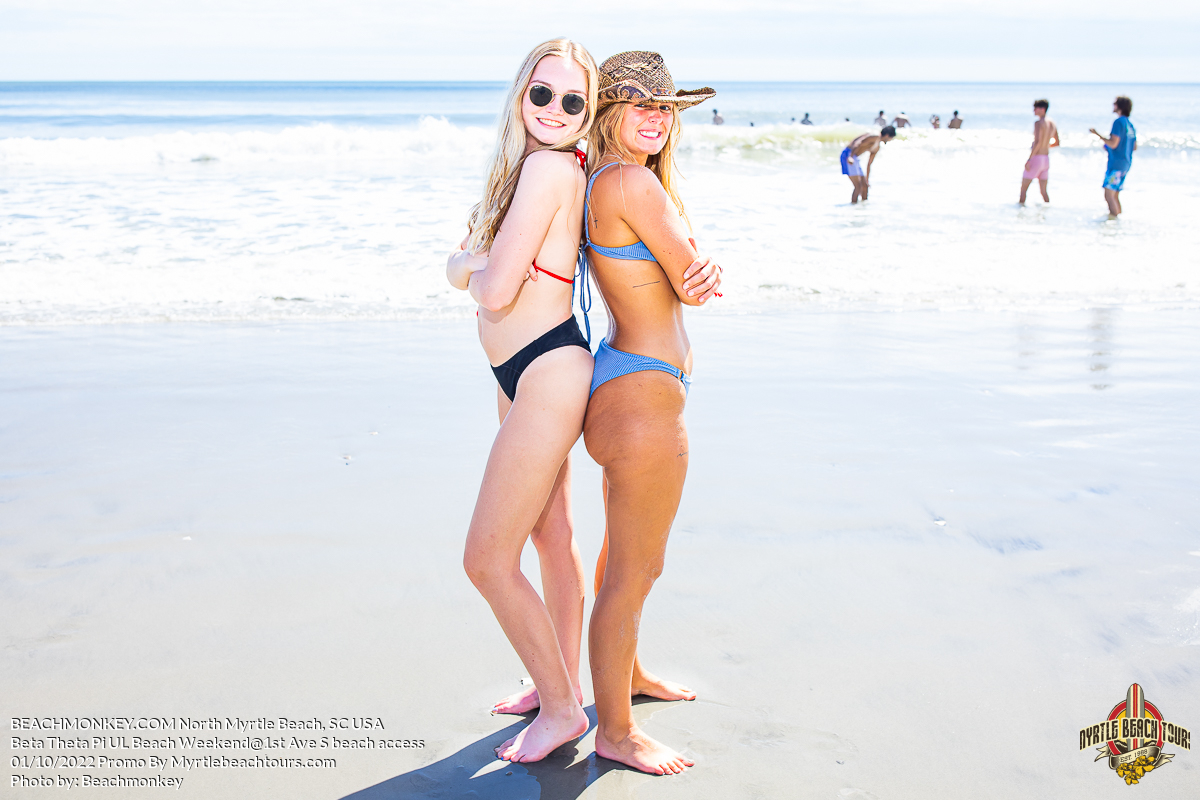 two beautiful sorority girls in bikinis on beach Beta Theta Pi U of Louisville Fraternity Beach Weekend North Myrtle Beach, SC USA sponsored by Myrtlebeachtours.com October 1st 2022 Photos by Beachmonkey a Myrtle Beach photographer